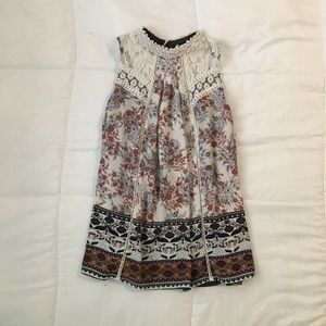 A sleeveless blouse with flower patterns
